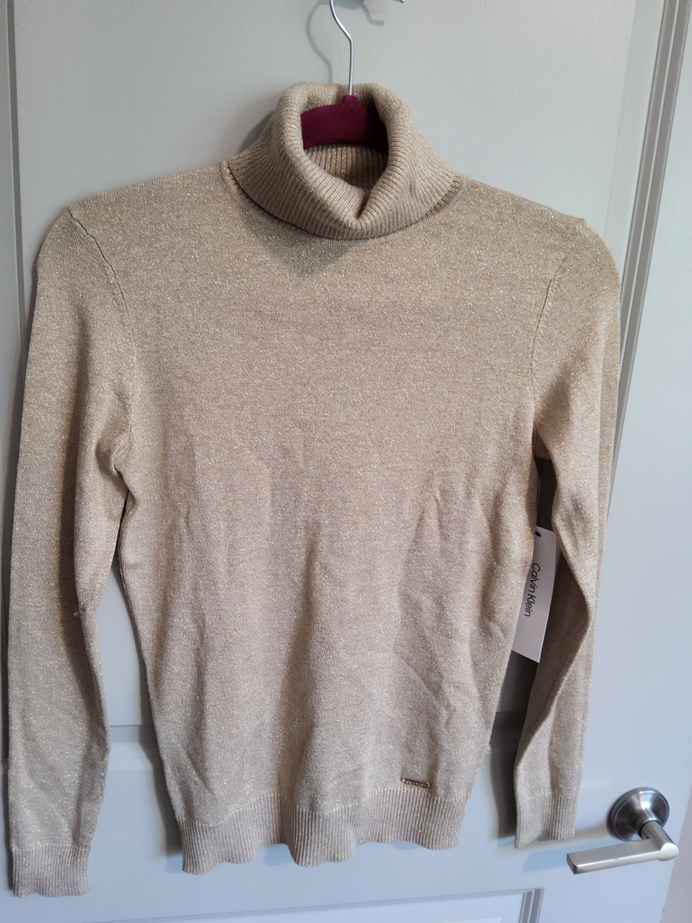 Calvin Klein gold shimmer turtle neck sweater